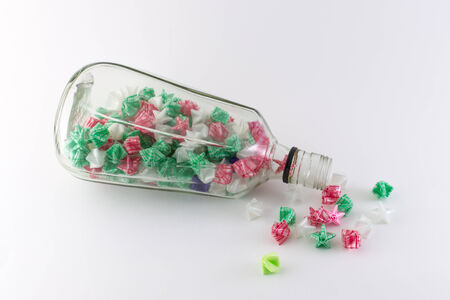 Paper stars in  whisky bottle on white backgroundの写真素材