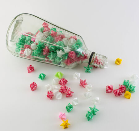 Paper stars in  whisky bottle on white backgroundの写真素材