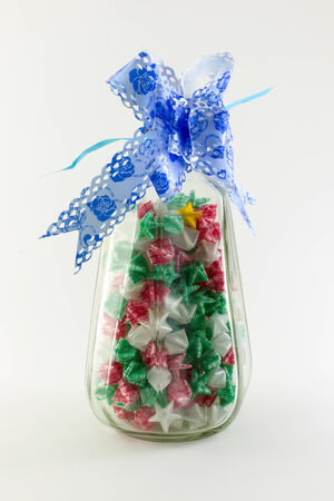 Paper stars in  whisky bottle on white backgroundの写真素材