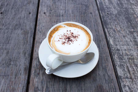 Hot Coffee cup on Wooden Tableの写真素材