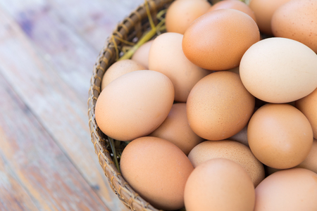 Brown Eggs on Wooden Tableの写真素材