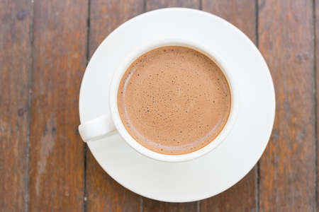 Hot coffee cup on wooden tableの写真素材