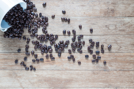 Coffee beans on  wooden backgroundの写真素材