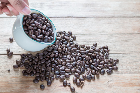 Coffee beans on  wooden backgroundの写真素材