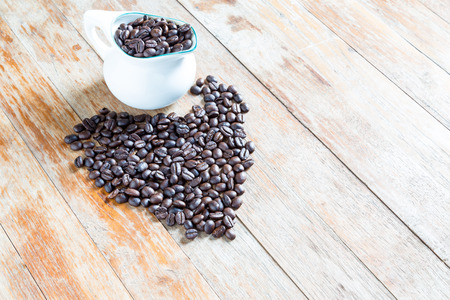 Coffee beans on  wooden backgroundの写真素材