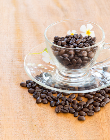 Coffee beans on wooden backgroundの写真素材