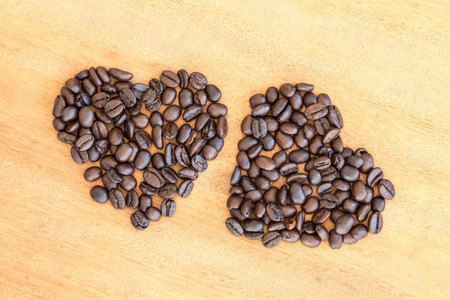 Coffee beans on wooden backgroundの写真素材