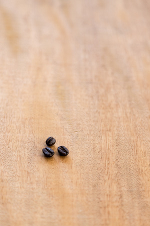 Coffee beans on wooden backgroundの写真素材