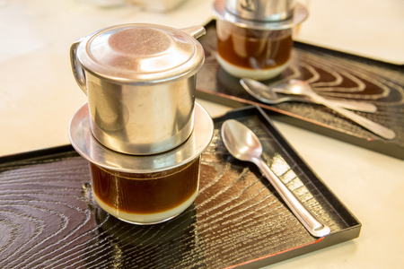 coffee dripping in vietnamese style on  tableの写真素材
