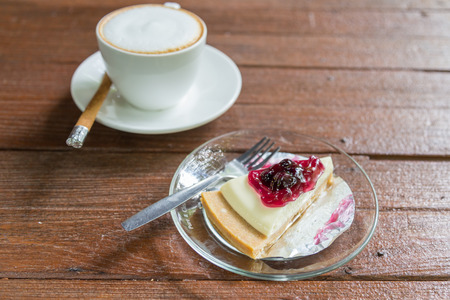 Hot cappuccino coffee cup and banana cakeの写真素材