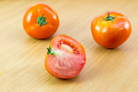 fresh Tomatoes on a woodden  backgroundの写真素材
