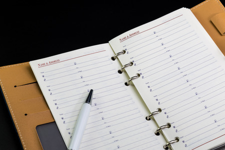 Personal organizer address book and penの写真素材