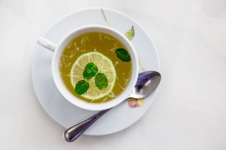 tea with lemon and mint in a  mugの写真素材