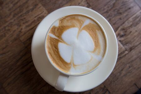 Hot coffee in a white cup on tableの写真素材