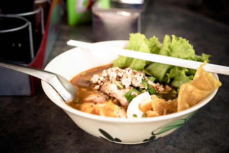 Noodles spicy soup with pork in bowlの写真素材