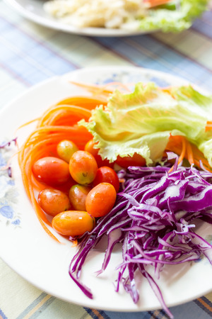 Fresh mixed vegetables salad on decorate on dishの写真素材