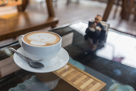 Hot coffee in a white cup on tableの写真素材