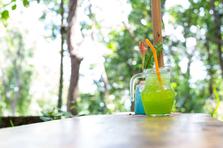 ice green tea on table in gardenの写真素材