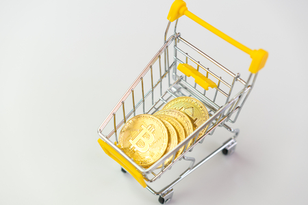 bitcoin in the shopping cart white backgroundの写真素材