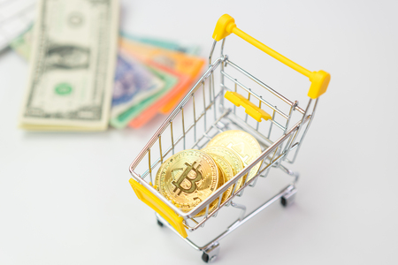 Bitcoin in the shopping cart white backgroundの写真素材