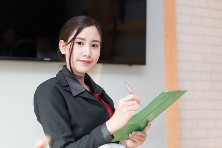 Business woman holding folder tablet workの写真素材