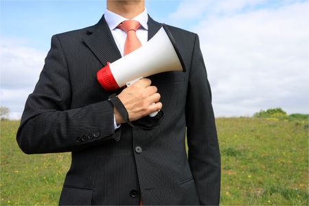 A business man holding a megaphoneの写真素材