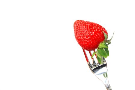 Strawberry and fork isolated on a white background with space for textの写真素材