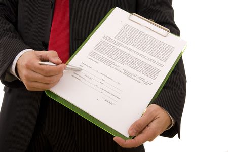 Business man showing the place where the seller must sign the contract (home made contract) Business man showing the place where the seller must sign the contract (home made contract)