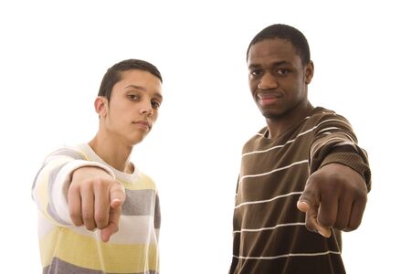 Two young men pointing to you isolated on whiteの写真素材