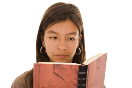 Young girl reading a book isolated on white