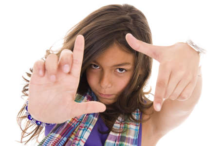 Young girl doing hand frame gesture isolated on whiteの写真素材