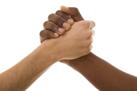 Black and white hands shaking in friendly agreement isolated on whiteの写真素材