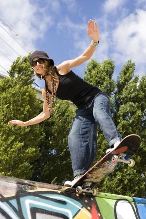 Urban life - Beautiful young women with skateboardの写真素材