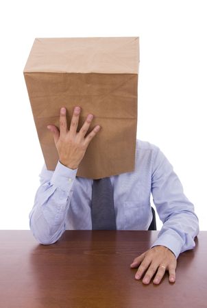 Men with a cardboard bag on his head thinkingの写真素材