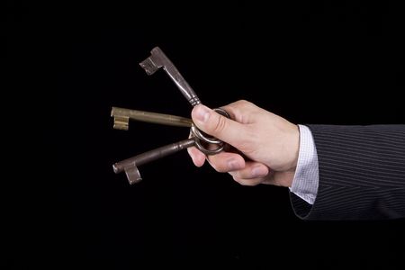 A businessman asking to someone to choose a keyの写真素材