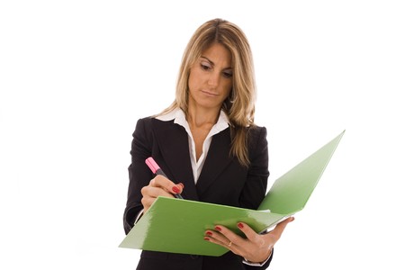 Beautiful with a green folder writing somethingの写真素材