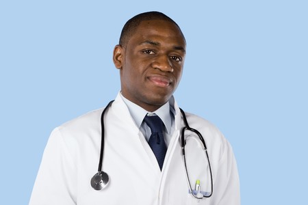 African doctor with a stethoscope around his neck isolated on blueの写真素材