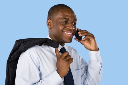 Young business man on phone isolated on blue