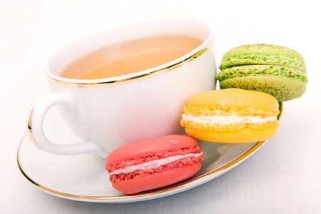 Cup of tea with colorful french macaronの写真素材