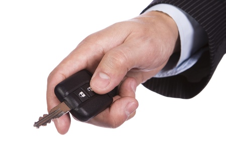 Hand opening the car door with a remote controlの写真素材