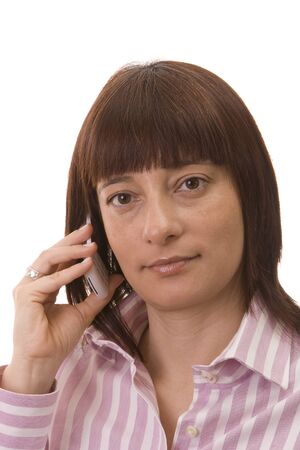 Portrait  of a beautiful woman using her cell phoneの写真素材
