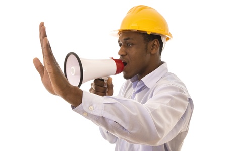 Young black worker giving orders with a megaphoneの写真素材