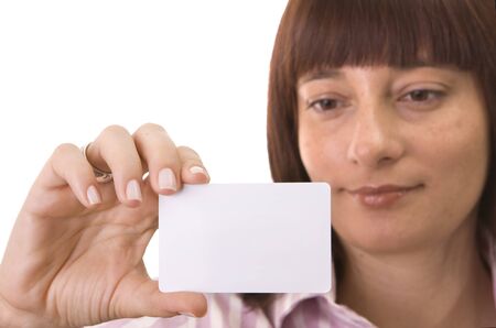 Woman looking to  a blank business cardの写真素材