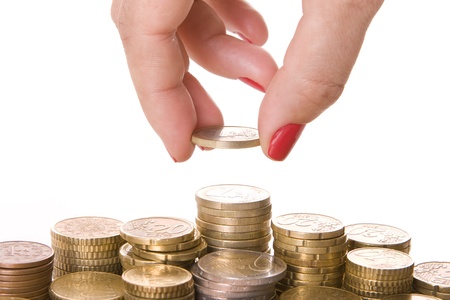 Close-up of womanï¿½s fingers picking a coinの写真素材