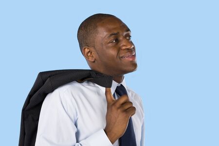 Portrait of an happy africain business man on a blue backgroundの写真素材