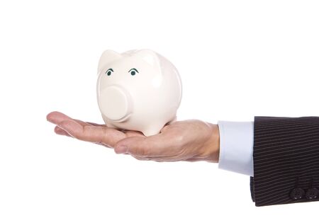 Saving concept - Male«s hand holding a white piggy bankの写真素材