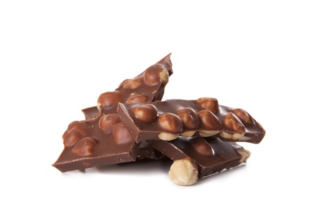 Milk chocolate with nuts on a white backgroundの写真素材