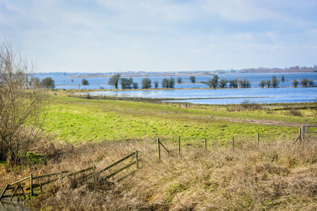 Flooded farmland in Norfolk UK on a bright day in Winter