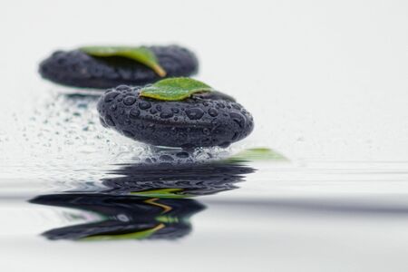 Spa stones with reflection in the waterの写真素材