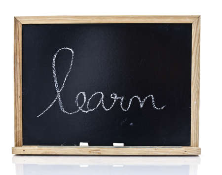 Word learn handwriting on a blackboard in white backgroundの写真素材